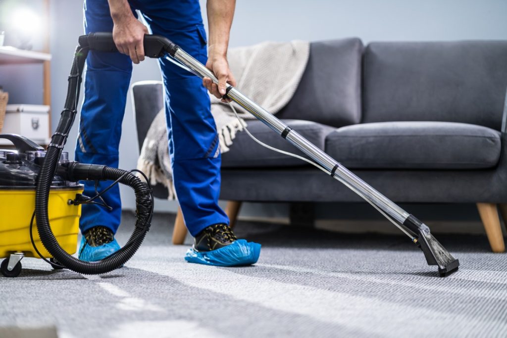 Person Cleaning Carpet With Vacuum Cleaner Picture Id1191080465 1024x683 